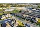 Aerial view of townhomes with parking and green spaces in a well maintained planned community at 696 Orange Belt Loop, Winter Garden, FL 34787