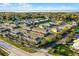 Aerial view of a residential community with townhouses, ponds, and manicured landscaping at 696 Orange Belt Loop, Winter Garden, FL 34787