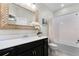 Well-lit bathroom features a bathtub, toilet, decorative mirror, and modern vanity with ample storage at 696 Orange Belt Loop, Winter Garden, FL 34787