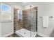 Walk-in shower with custom tile surround and frameless glass enclosure at 696 Orange Belt Loop, Winter Garden, FL 34787