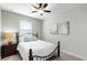 Bedroom with a black bed frame, and light green colored walls at 696 Orange Belt Loop, Winter Garden, FL 34787