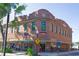 A red brick corner commercial building in downtown with a crosswalk and bicycles at 696 Orange Belt Loop, Winter Garden, FL 34787