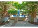 Beautiful fountain with cascading water, tile accents and lush greenery provides a serene ambiance at 696 Orange Belt Loop, Winter Garden, FL 34787