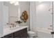 Elegant bathroom featuring gold fixtures, neutral color palette, and stylish decor at 7323 Sienna Wood Ave, Orlando, FL 32829