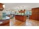 Spacious kitchen featuring granite countertops, stainless steel appliances, and custom wood cabinetry at 7496 Lake Marsha Dr, Orlando, FL 32819