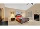 Bedroom showcasing neutral walls, vaulted ceiling and plantation shutters at 7655 Debeaubien Dr, Orlando, FL 32835