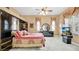 Spacious main bedroom with a ceiling fan, matching furniture, and natural light from shuttered windows at 7655 Debeaubien Dr, Orlando, FL 32835