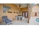 A covered patio with ceiling fan offers a cool place to relax near pool at 7655 Debeaubien Dr, Orlando, FL 32835