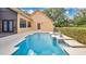 Aerial shot showcasing a beautiful pool and manicured landscaping at 7655 Debeaubien Dr, Orlando, FL 32835