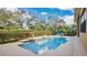 Private pool and manicured hedges create a peaceful backyard oasis at 7655 Debeaubien Dr, Orlando, FL 32835