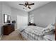 Bedroom with carpeted floors, ceiling fan, and plenty of closet space at 814 Kazaros Cir, Ocoee, FL 34761