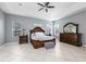 Spacious bedroom with a tray ceiling, large windows, and wood furniture at 814 Kazaros Cir, Ocoee, FL 34761