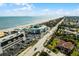 Panoramic aerial view showcasing beachfront properties with easy access to the ocean, plus nearby commercial areas at 815 Ocean Shore Blvd # U7A, Ormond Beach, FL 32176