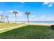 A green space leads the way to beach access featuring sand, sky, and ocean views at 815 Ocean Shore Blvd # U7A, Ormond Beach, FL 32176