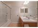 Clean bathroom with double sinks, wood cabinets, and a shower-tub combination at 8168 Boat Hook Loop # 707, Windermere, FL 34786