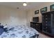 Bedroom featuring a ceiling fan, closet space, dark furniture, and black and white floral bedding at 8168 Boat Hook Loop # 707, Windermere, FL 34786