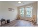 Well-lit bedroom with two large windows and wood-look floors at 8168 Boat Hook Loop # 707, Windermere, FL 34786