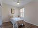 Bright bedroom featuring a twin bed, ceiling fan, and wood-look floors at 8168 Boat Hook Loop # 707, Windermere, FL 34786