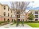 Exterior view of a well-maintained apartment building with lush landscaping, perfect for serene living at 8168 Boat Hook Loop # 707, Windermere, FL 34786