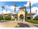 Welcoming clubhouse entrance with tall palm trees, a seating area, and elegant architectural details at 8168 Boat Hook Loop # 707, Windermere, FL 34786