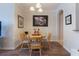 Cozy dining room with wood-style flooring, chandelier and wall decorations at 8168 Boat Hook Loop # 707, Windermere, FL 34786