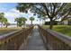 Picturesque dock leading to the water, offering a scenic viewpoint and a tranquil waterside setting at 8168 Boat Hook Loop # 707, Windermere, FL 34786