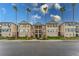 A charming condo building with well-maintained landscaping and beautiful palm trees at 8168 Boat Hook Loop # 707, Windermere, FL 34786