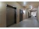 Well-maintained building hallway with elevator access, ensuring convenience and accessibility for residents at 8168 Boat Hook Loop # 707, Windermere, FL 34786