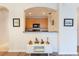 Partial view of kitchen showcasing wood cabinetry, breakfast bar and white storage cabinet at 8168 Boat Hook Loop # 707, Windermere, FL 34786