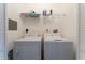 Convenient laundry room with a washer, dryer, and storage shelf at 8168 Boat Hook Loop # 707, Windermere, FL 34786