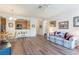 Comfortable living room with hardwood floors and an open view of the kitchen at 8168 Boat Hook Loop # 707, Windermere, FL 34786