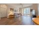 Bright living room with laminate floors, leading to a screened patio and lots of natural light at 8168 Boat Hook Loop # 707, Windermere, FL 34786