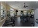 A large gym with free weights, machines and television in the workout space at 8168 Boat Hook Loop # 707, Windermere, FL 34786