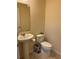 Half bathroom with a pedestal sink and toilet at 8237 Serenity Spring Dr # 2605, Windermere, FL 34786