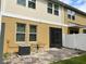 Exterior view of the home featuring a patio area and well-maintained backyard at 8237 Serenity Spring Dr # 2605, Windermere, FL 34786