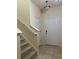 Bright foyer featuring tile flooring, stairway to the left and a front door at 8237 Serenity Spring Dr # 2605, Windermere, FL 34786