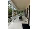 Charming front porch with rocking chairs and classic architectural details at 8237 Serenity Spring Dr # 2605, Windermere, FL 34786