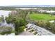 Aerial view of townhomes located near community soccer field and a lake at 832 Westshore Ct, Casselberry, FL 32707