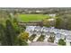 Aerial view of townhomes near the water, soccer field and park amenities at 832 Westshore Ct, Casselberry, FL 32707