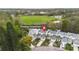 Aerial view of townhomes near a park with a soccer field at 832 Westshore Ct, Casselberry, FL 32707