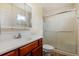 Bathroom featuring a single sink vanity with a mirrored medicine cabinet and glass shower at 832 Westshore Ct, Casselberry, FL 32707