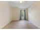 Comfortable carpeted bedroom with a ceiling fan and a window with blue curtains at 832 Westshore Ct, Casselberry, FL 32707