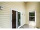 Back patio with sliding door and window and vinyl siding at 832 Westshore Ct, Casselberry, FL 32707