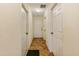 Hallway with neutral walls and tile flooring, leading to multiple rooms at 832 Westshore Ct, Casselberry, FL 32707