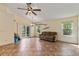 Bright living room featuring vaulted ceilings, tile floors, and sliding glass doors to a patio at 832 Westshore Ct, Casselberry, FL 32707