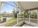 Screened-in porch overlooking a peaceful canal, providing an outdoor living space at 832 Westshore Ct, Casselberry, FL 32707