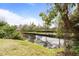 A peaceful waterway with manicured sidewalks and benches can be seen here at 832 Westshore Ct, Casselberry, FL 32707