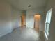 Bedroom view showing new tile flooring, a ceiling fan, and a closet at 1006 India St, Haines City, FL 33844