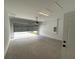 A spacious garage with a concrete floor and an automatic door at 1006 India St, Haines City, FL 33844