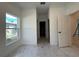 Hallway with new paint, tile floor, and natural light at 1006 India St, Haines City, FL 33844